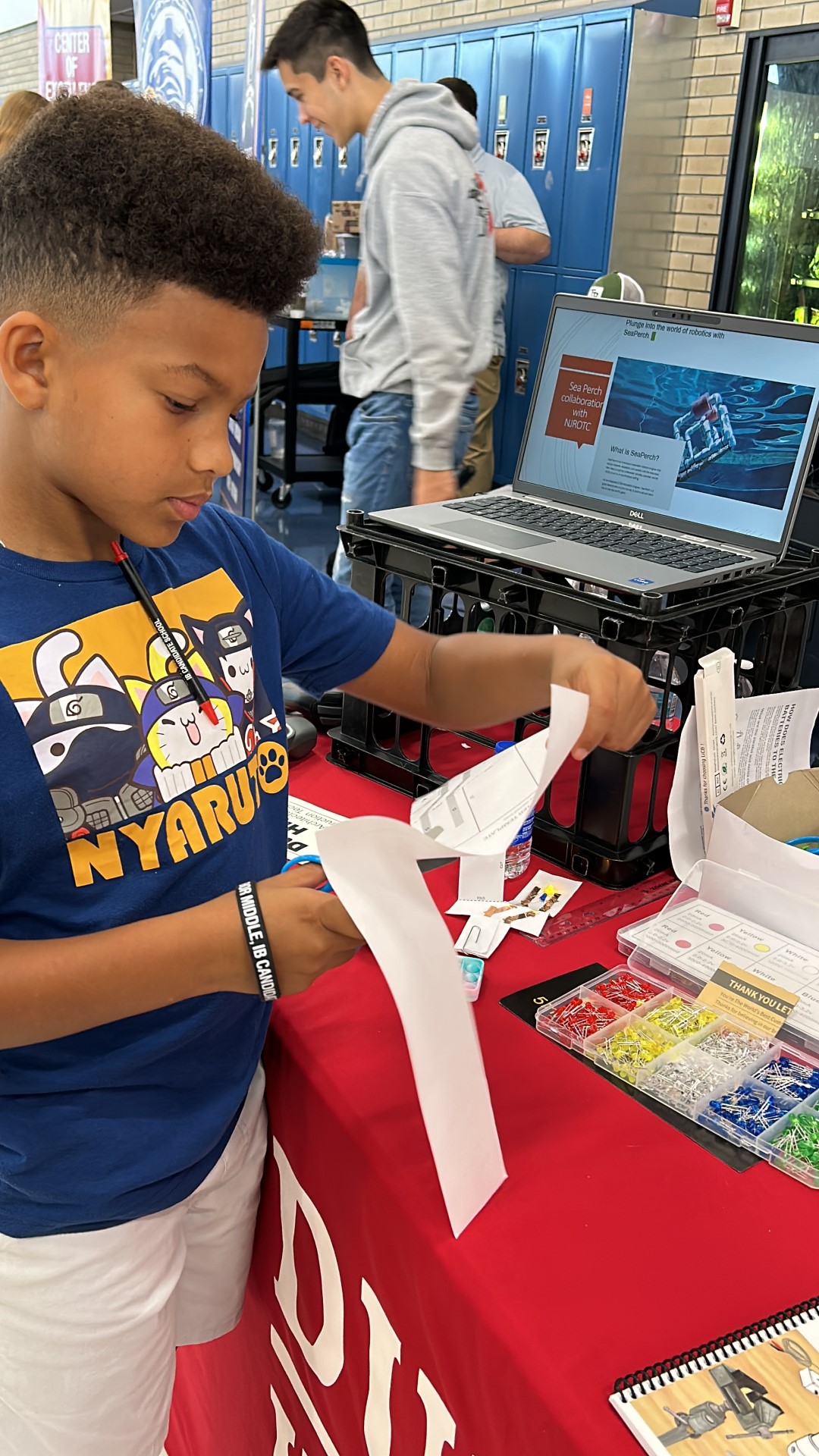 A child looking at paperDescription automatically generated